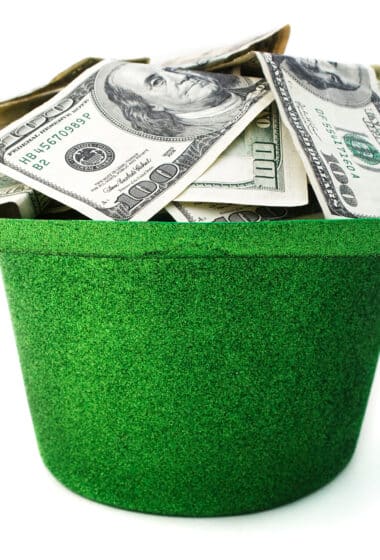 money in a green hat
